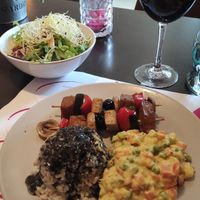 Daily menu: "french" salad, tofu and seitan on sticks and brown rice with black sesame sauce, natural grape juice #Veganuary at Vegehop in Zagreb