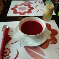 Beet soup and apple juice at Vegehop at Vegehop in Zagreb