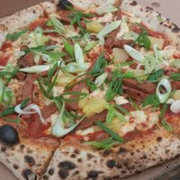 Pineapple pizza at Young Vegans Pizza Shop in London