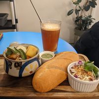 Vegan stew and ice peach tea at Rustle & Still in Toronto