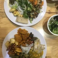 Plate filled with different tofu varieties, veggies, nuts,... at Moc Chay in Hanoi