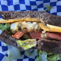 a couple bites into my McLeo's Tofu Egg Muffin at Leo's Superfood Vegan Cafe in Northridge