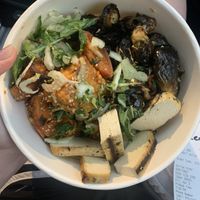Tofu bowl with brussel sprouts and chili glazed sweet potatoes  at Flower Child in Houston
