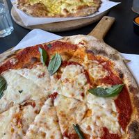 Tomato, vegan mozzarella & fresh basil pizza, and garlic bread at Hangin' Pizzeria in Betws-y-coed