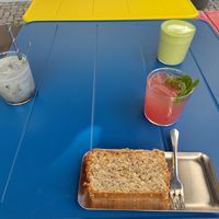 Lemon/poppy seed cake, homemade lemonade, matcha latte and charcoal latte at Bohemian Kids Café in Leipzig