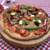 Pizza with vegan cheese at Mezzaluna in Loreto