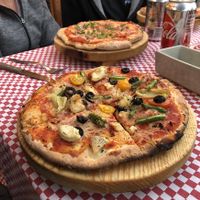 Pizza with vegan cheese at Mezzaluna in Loreto