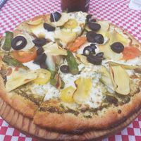Red sauce, artichoke, black olive, asparagus, cherry tomato pizza at Mezzaluna in Loreto