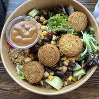 Create your own bowl with Falafel and evil peanut on the side  at The Chopped Leaf in Brandon