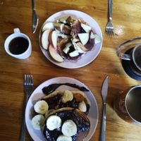 2 pancake plates: 1 with banana and chocolate and the other one with cherry jam and apples 😋 at French Made in Tienen