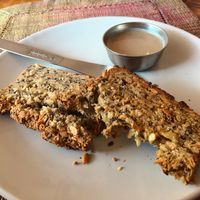Freshly baked nut bread with homemade coconut butter, must try!  at Karma Cafe in Palolem