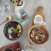 Green goddess bowl, chakra wheel and coffee with soy milk at Loving Earth Cafe in Fort Kochi