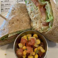 Chickpea salad sandwich with side of corn salsa  at Strong Hearts in Syracuse