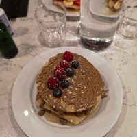 Vegan pancakes with raspberry, blueberry and almond butter at POG - Tara St in Dublin