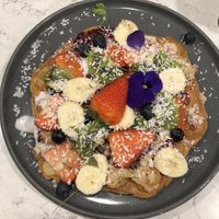 Vegan waffle with coconut cream and cashew butter  at POG - Tara St in Dublin