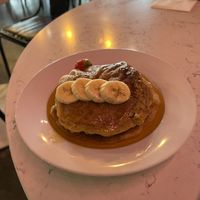 Vegan pancakes with strawberry, bananas, maple syrup  at POG - Tara St in Dublin