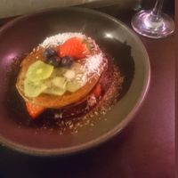 Vegan pancakes with berries, kiwi, coconut and maple syrup at POG - Tara St in Dublin