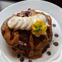 Vegan protein pancakes with almond butter, banana, coconut cream and maple syrup at POG - Tara St in Dublin