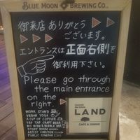 Signboard says "vegan yoga" at Land Cafe in Tokyo