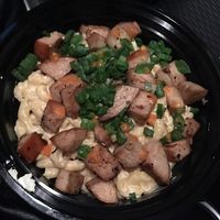 Vegan Mac N Cheese with Vegan Pork added scallions as a garnish.  at Mac n' Cheese Rebel in Los Angeles