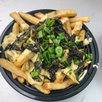 Cheese fries with kale at Mac n' Cheese Rebel in Los Angeles
