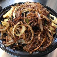 Cheese fries with kale and fried onions at Mac n' Cheese Rebel in Los Angeles