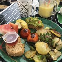 Vegan Breakfast - fried potatoes, avo on toast, kithul (palm syrup) on toast, tomatoes and fruit at The Container Beach Restaurant in Negombo