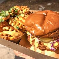 Hot chicken sandwich and waffle fries at Veggie Fam in Los Angeles