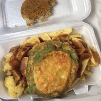 Pea fritter, gravy mix and vegan fish cake  at Leon's in Clay Cross