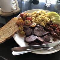 Sweet potato wedges, sourdough bread, scrambled tofu, cherry tomatoes, mushrooms and sliced apple. at Asa Vegan Kitchen and Studio in Chiang Mai