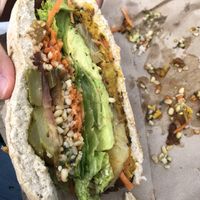 Veggie burger made vegan! ITS HUGE at The Fat Tui in Marahau