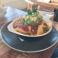 Vegan nachos with vegan cheese YUM  at Rise in Bridport
