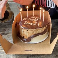 The ganache melted to our doing having an outdoor birthday party where it sat out for hours. Still tasted delicious!  at Short Street Cakes in Asheville