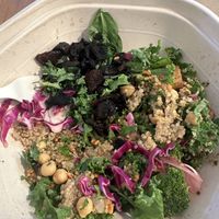 Half eaten protein bowl with tofu, quinoa and chick peas    at sweetgreen - Michigan Ave in Chicago