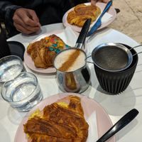 Tofu scramble & bacon croissant, almond croissant and ham & cheese croissant with a chai latte :) at Weirdoughs in Melbourne
