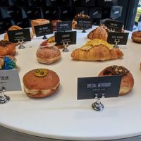 Their sweet donuts collection with a Mac and cheese croissant in the middle at Weirdoughs in Melbourne