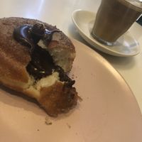 Café latte with oat milk and a nice sweet dream😍  at Weirdoughs in Melbourne