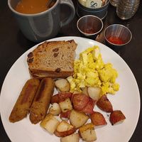 Tofu eggs with roasted potatos and vegan sausage.  Was very good.   Also had a vegan cinnamon bun. 👍...
 at Honey B's in Frankenmuth