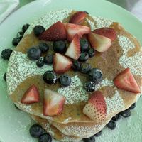 Vegan pancakes with fresh fruit. *we sat outside under the green canopy so the color is a little off 🙃 at Honey B's in Frankenmuth
