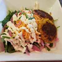 Buddha bowl with squash quinoa cakes at Restoration Cafe in Manchester