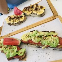 Tomato Avocado toast and banana dates toast 😋 at Parcería - Culto Al Cafè in Sevilla