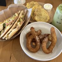 Cubano sandwich with plantain chips, tostones with garlic cilantro sauce, bunuelos, iced maple matcha 🤤  at Vegan Cuban Cuisine in Miami