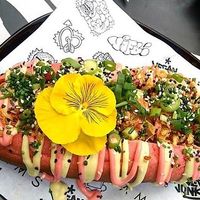 An amazing sausage by Beyond Meat murdered with way too much crappy sauce.  at Vegan Junk Food Bar - Downtown in Amsterdam