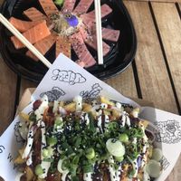 vegan 12 piece sashimi of tuna and salmon and fried chicken dirty fries  at Vegan Junk Food Bar - Downtown in Amsterdam