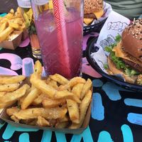 Original burger, truffle fries, tipsy unicorn drink at Vegan Junk Food Bar - Downtown in Amsterdam