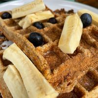 Waffles with banana, berries, cinnamon and maple syrup at Jay's Brunch Caffe in Parede