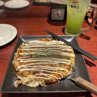 Modern vegan Okonomiyaki with a green apple sour alcoholic drink   at Zen in Tokyo