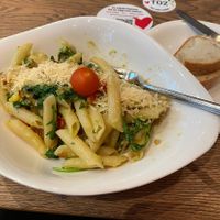 CREMA DI AVOCADO - Vegan pasta with cherry tomatoes, bell peppers, rucola and onions all mixed with a dash of blended avocados, topped with vegan melt.  at Vapiano - Solaris in Tallinn