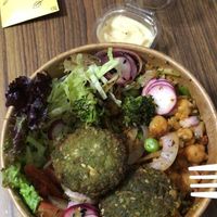 Inferno protein bowl with plastic forks and plastic containers at Nut and Bowls in New Delhi