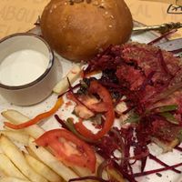 Dry pre-cut veggies in burger and very average fries  at Nut and Bowls in New Delhi
